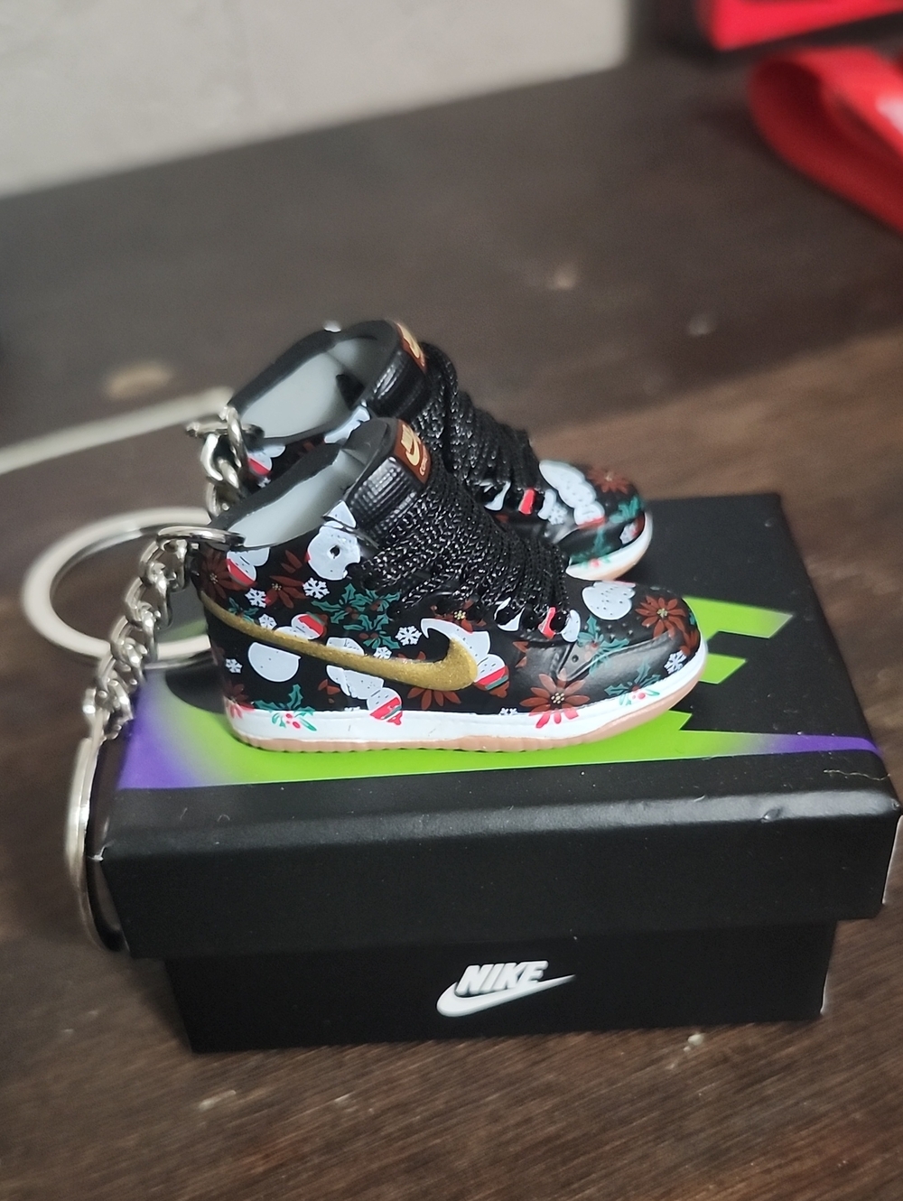 Nike Black Floral Mini Sneaker Keychain with Gold Swoosh Snowmen
